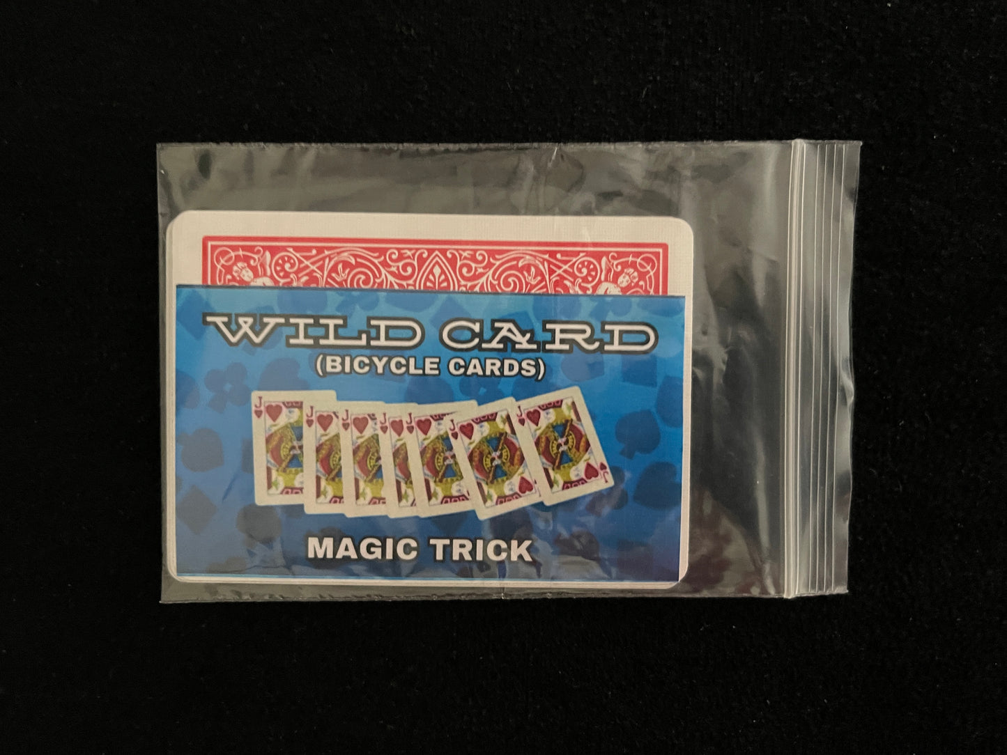 Clear plastic bag containing a wild card magic trick deck of Bicycle playing cards.
