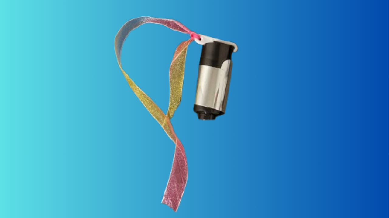 Appearing black cane fully collapsed against a blue background with a ribbon