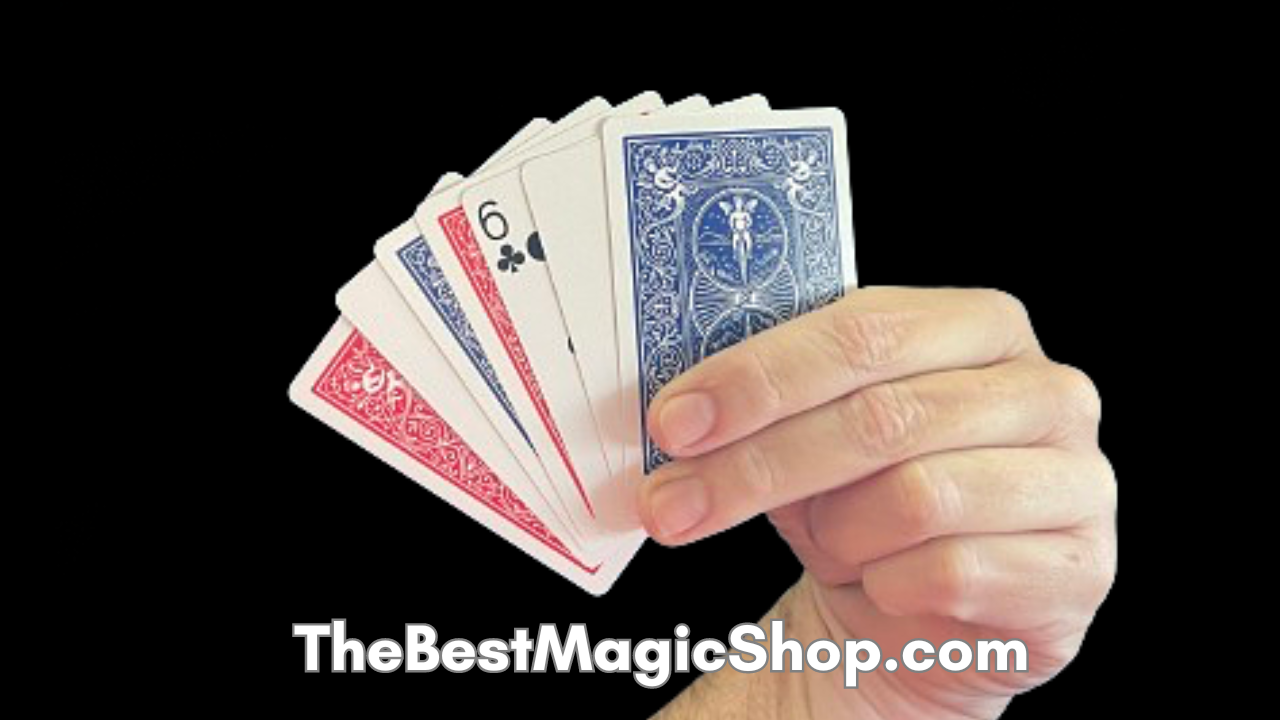 Hand holding a fan of playing cards, showing red and blue suits.