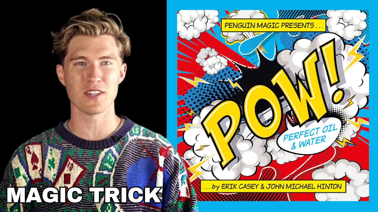 Man in a patterned sweater performing a magic trick, with a comic book-style poster for "Perfect Oil & Water" behind him.