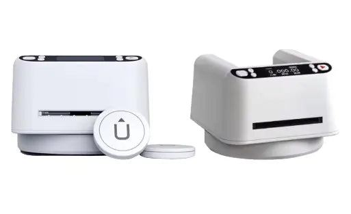 Two white automatic card dealer devices with control panels and small round buttons.