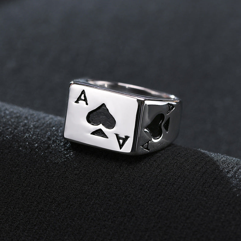 Silver ring featuring a square face with an ace of spades design.
