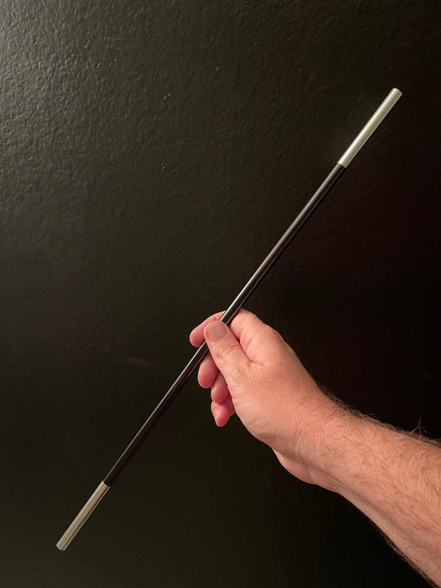 Hand holding the appearing magic wand