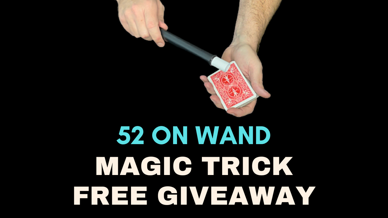 Hands holding a playing card with a magic wand positioned above, for a 52 on wand magic trick free giveaway.