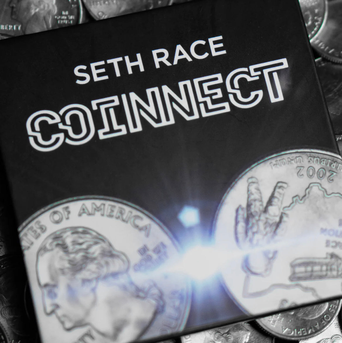 Magic trick cover titled "Seth Race COINNECT" visible in the background.