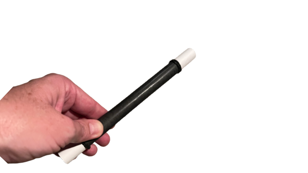 Hand holding a paper magic wand