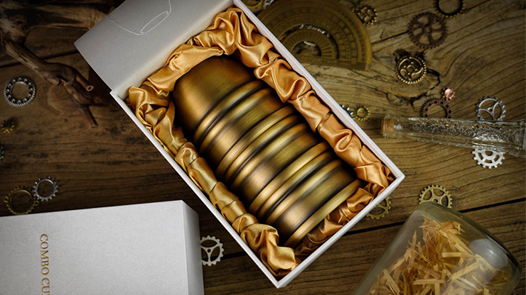 Three brass cups stacked in a box