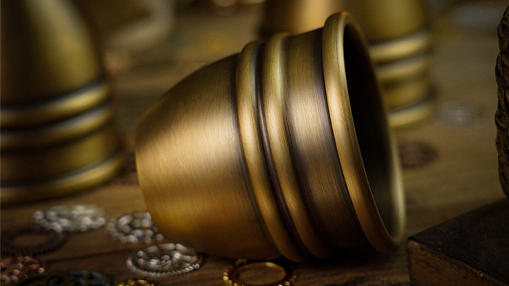 Close up of a brass cups used in the magic trick cups and balls