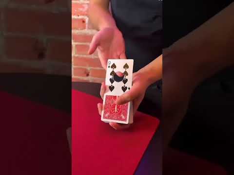 Magic trick cover featuring the title "TNT" in large, stylized letters, three dynamite sticks, and a sparkler. Short video 