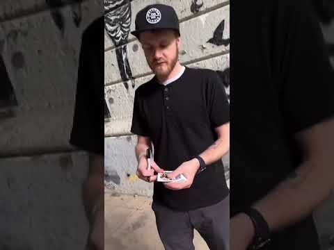 Magic trick cover for "NEO" by Nicholas Lawrence, featuring bold, white text on a background of distorted, colorful patterns. Short video